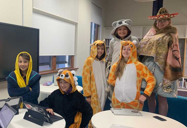 Children of emergency workers dressed up in costumes during remote learning supervision sessions