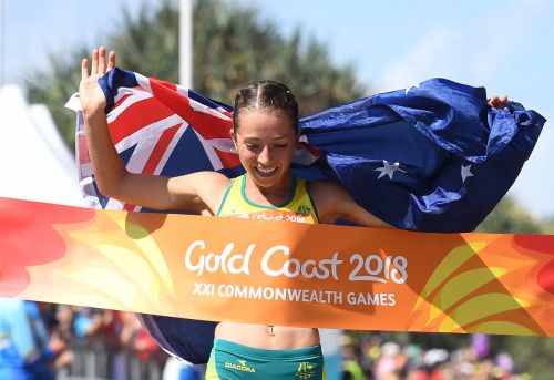 Elite athlete Jemima Montag crosses the finish line at the Commonwealth Games