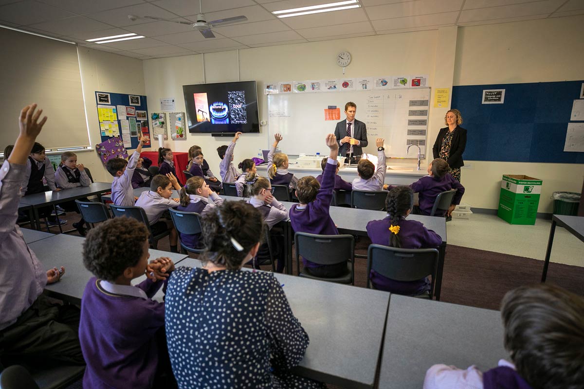 Two teachers teaching a class of students